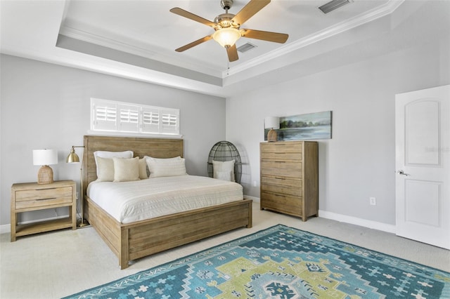 bedroom with a raised ceiling, ceiling fan, and crown molding