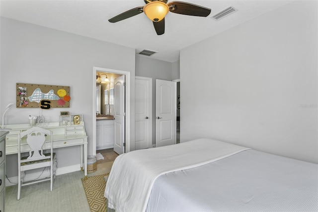 bedroom featuring ceiling fan and ensuite bathroom