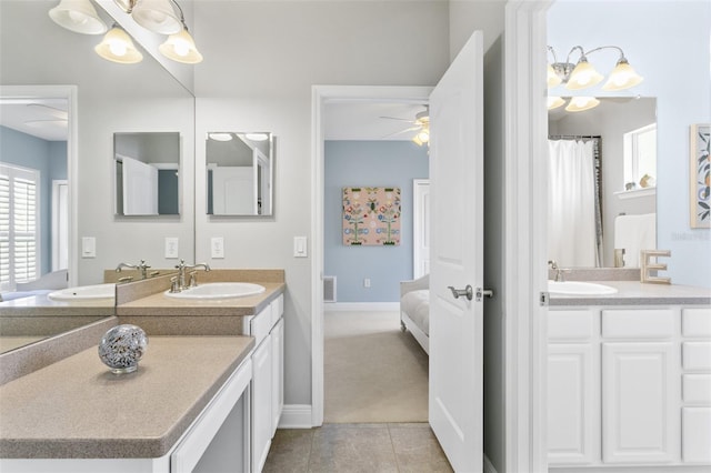 bathroom with ceiling fan, vanity, and tile patterned flooring