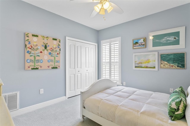 bedroom featuring ceiling fan, a closet, and carpet floors