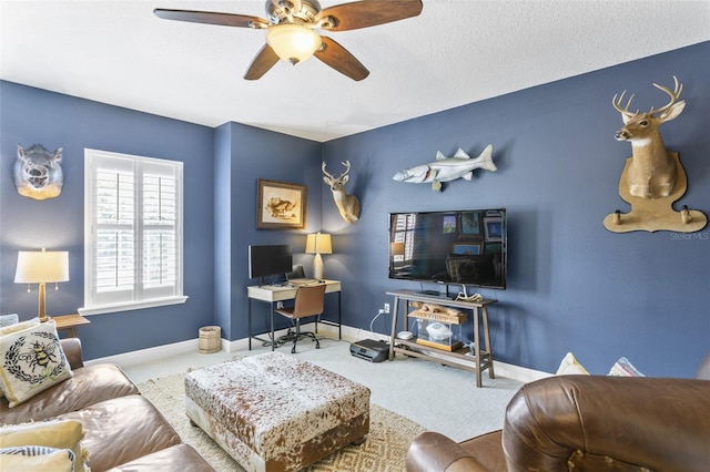 carpeted living room featuring ceiling fan