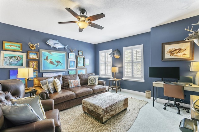 living room with carpet floors, a textured ceiling, and ceiling fan