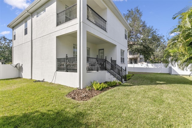 view of home's exterior with a yard