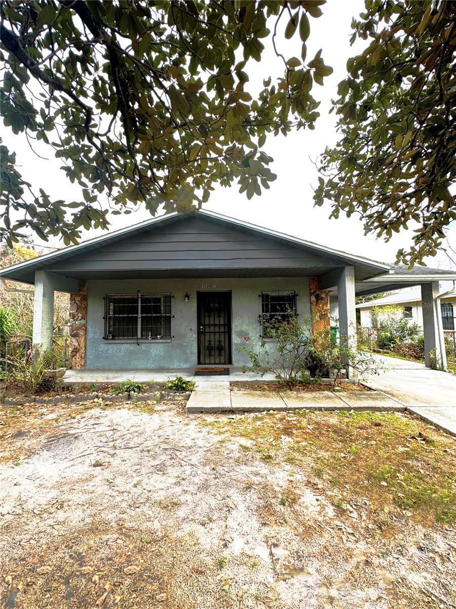 view of front of home with a carport