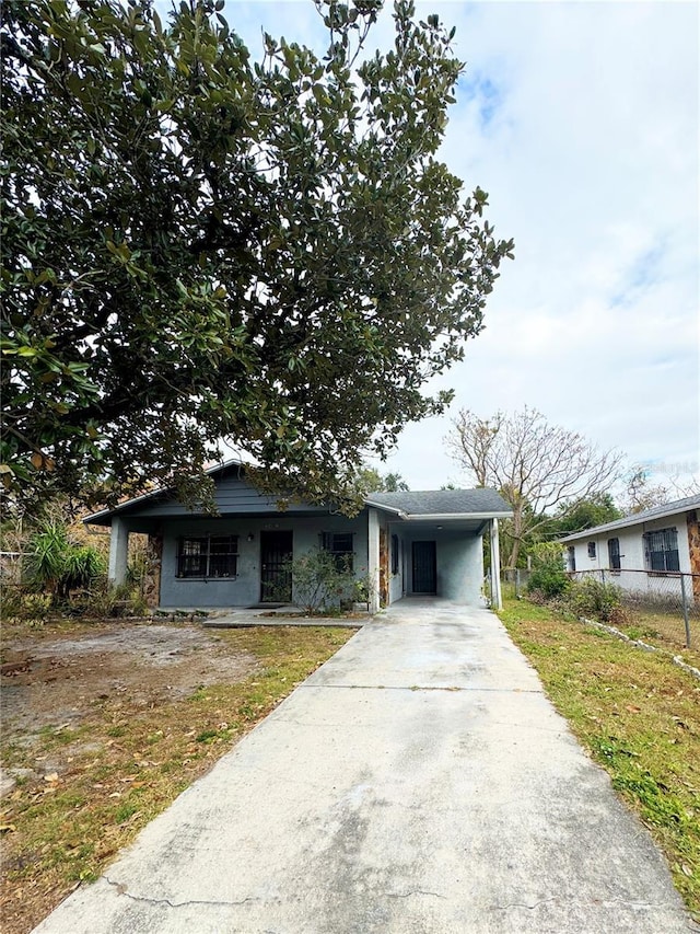 view of front of property featuring a carport