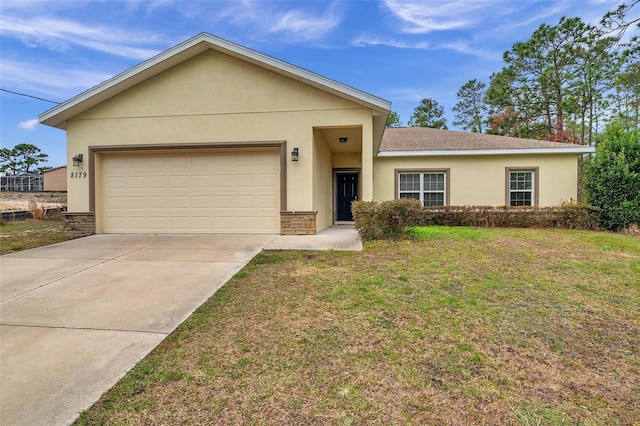 single story home with a front yard and a garage