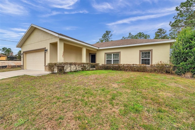 single story home with a garage and a front lawn