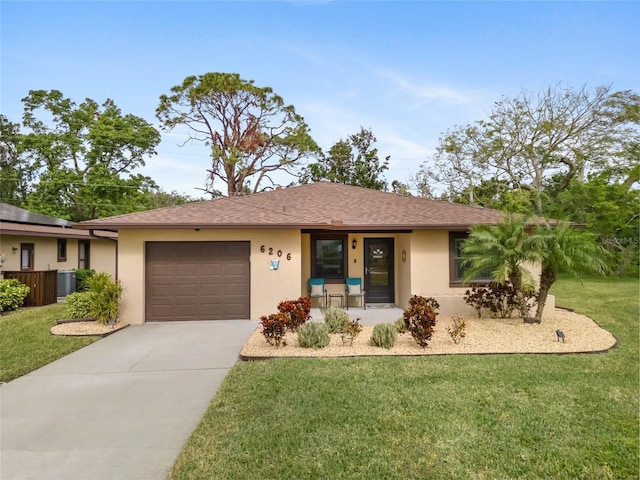 ranch-style house with a front yard, central AC, and a garage