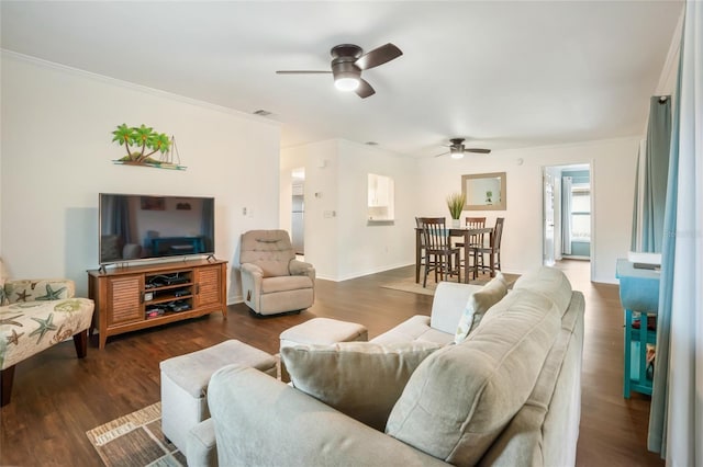 living room with ceiling fan, dark wood-type flooring, and crown molding