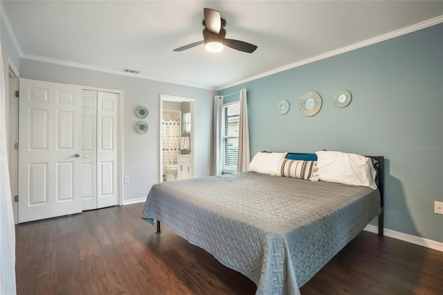 bedroom with ceiling fan, connected bathroom, a closet, dark hardwood / wood-style flooring, and crown molding