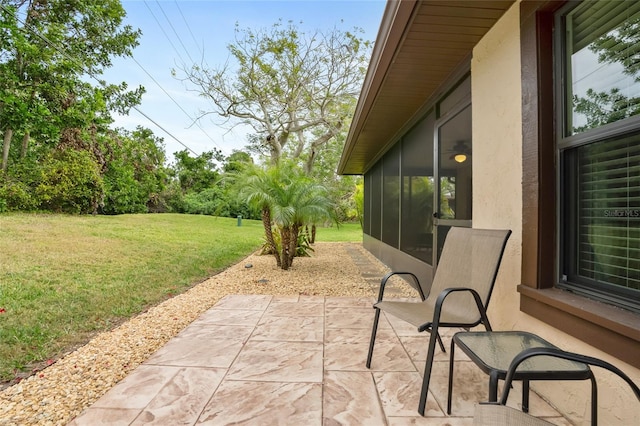 view of patio / terrace featuring a sunroom