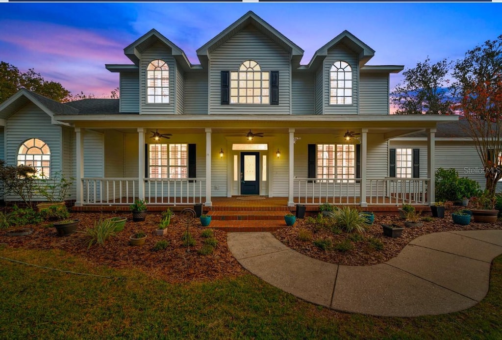 view of front facade featuring covered porch and ceiling fan