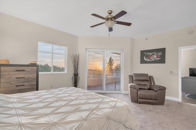 carpeted bedroom featuring ceiling fan and access to outside