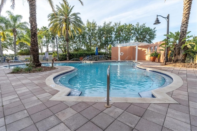 view of pool featuring a patio area and pool water feature