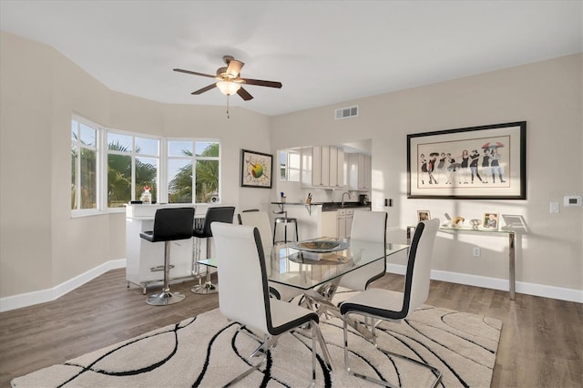 12077 Gandy Blvd N Unit 344, Saint Petersburg, FL 33702 - dining area featuring ceiling fan, wood finished floors, and baseboards