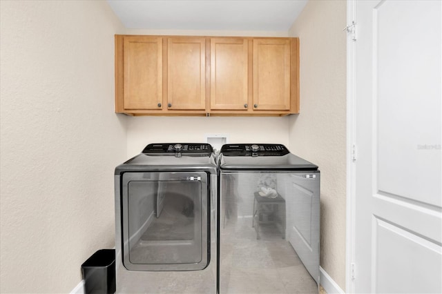 12077 Gandy Blvd N Unit 344, Saint Petersburg, FL 33702 - washroom featuring cabinet space, washer and clothes dryer, and baseboards
