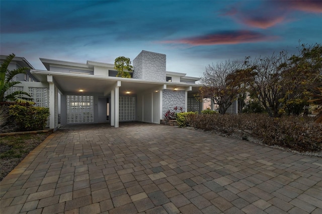 view of front of house featuring a carport