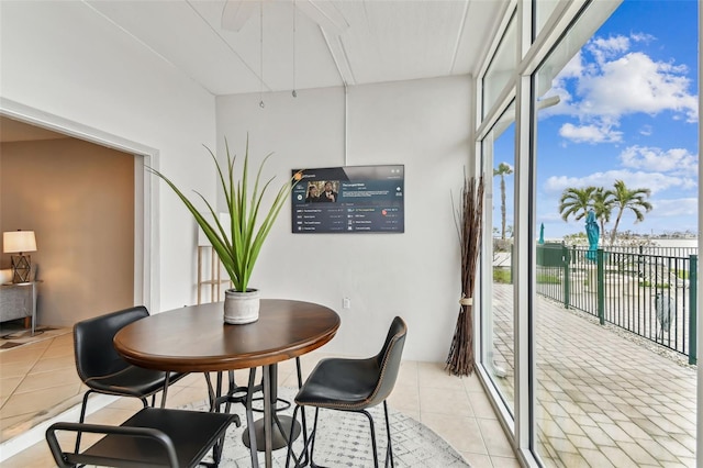 tiled dining space with expansive windows