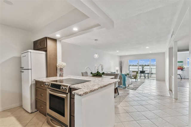 kitchen with stainless steel electric range oven, white fridge, light tile patterned flooring, and light stone counters