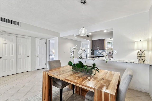 dining space with light tile patterned floors