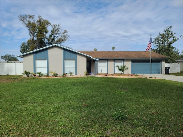 ranch-style home with a front yard and a garage