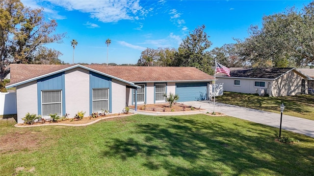 ranch-style house featuring a garage and a front lawn