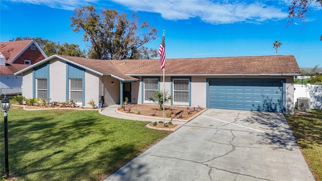 single story home with a garage, central AC, and a front yard