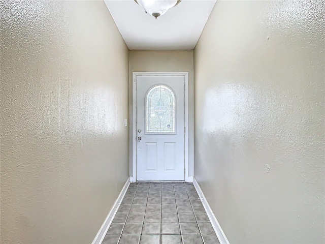 doorway featuring tile patterned flooring