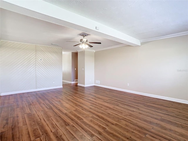 spare room featuring ceiling fan, ornamental molding, dark hardwood / wood-style flooring, and beam ceiling