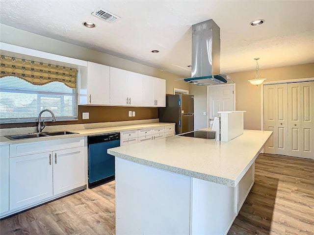 kitchen featuring island range hood, stainless steel fridge, dishwashing machine, pendant lighting, and white cabinets