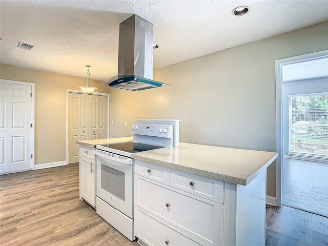 kitchen featuring white cabinetry, pendant lighting, island exhaust hood, and white electric range