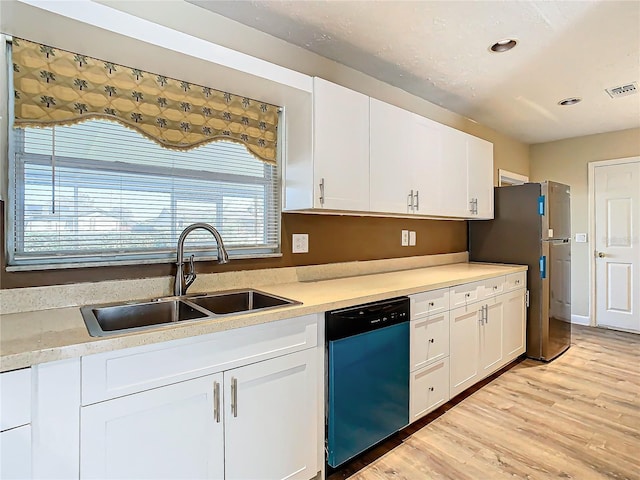 kitchen featuring dishwashing machine, sink, stainless steel refrigerator, light hardwood / wood-style floors, and white cabinets