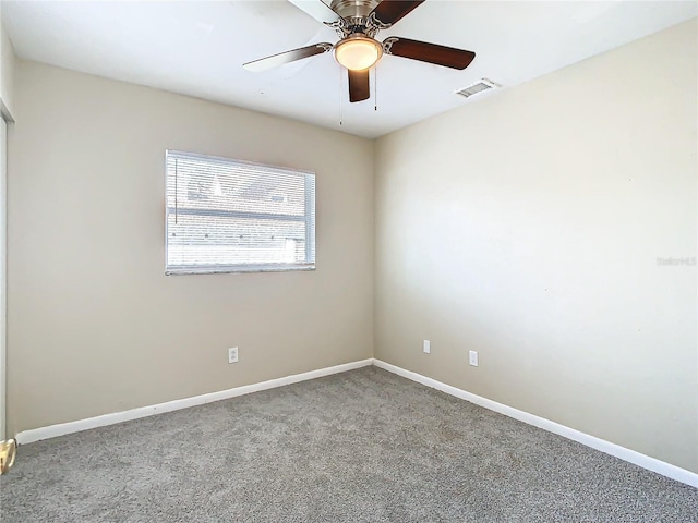 spare room with ceiling fan and carpet floors