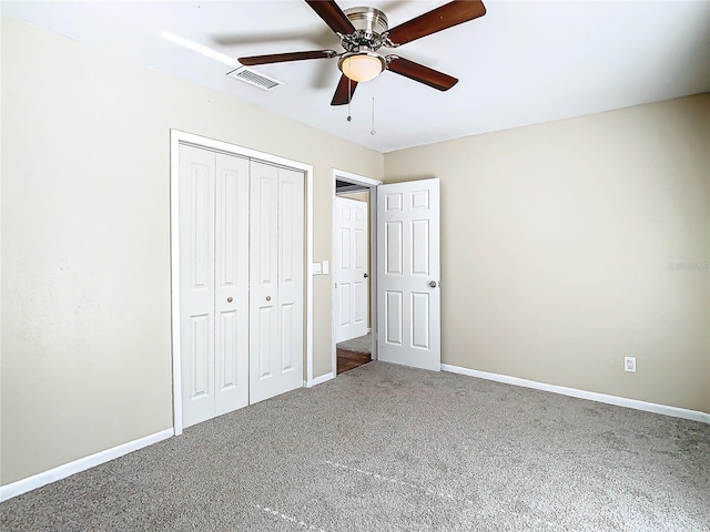 unfurnished bedroom featuring ceiling fan, carpet, and a closet