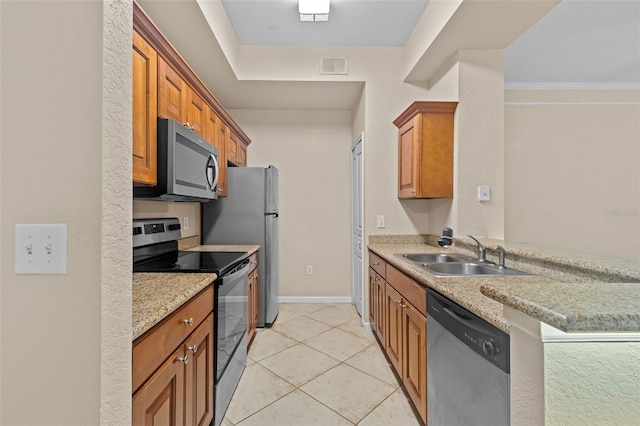 kitchen with light tile patterned flooring, appliances with stainless steel finishes, sink, crown molding, and light stone countertops