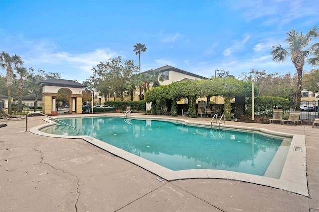 view of swimming pool with a patio