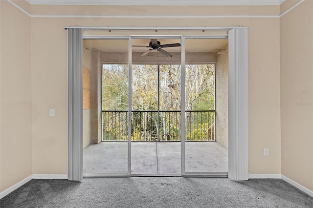 carpeted empty room featuring ceiling fan