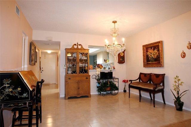 tiled dining area with a chandelier