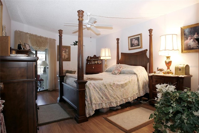 bedroom with dark wood-type flooring and ceiling fan