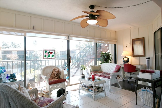 sunroom featuring ceiling fan