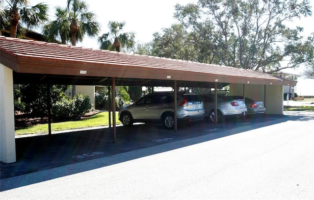 view of vehicle parking with a carport