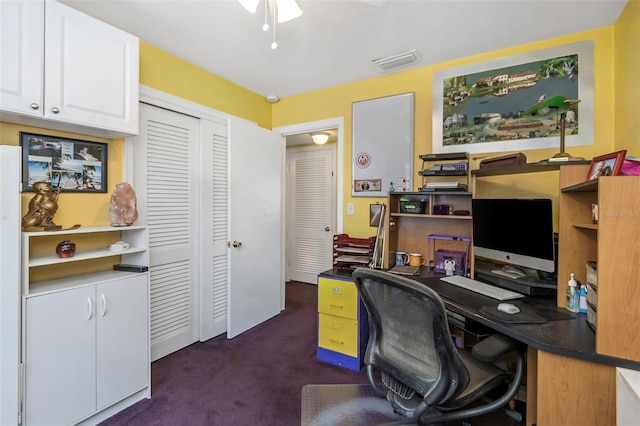 office area featuring ceiling fan and dark carpet