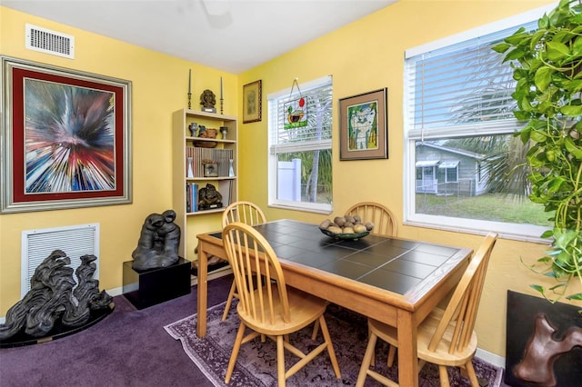 view of carpeted dining space