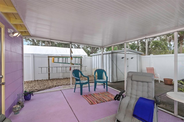 view of patio / terrace featuring a storage unit