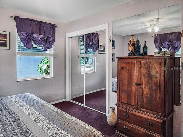 bedroom with baseboards and carpet