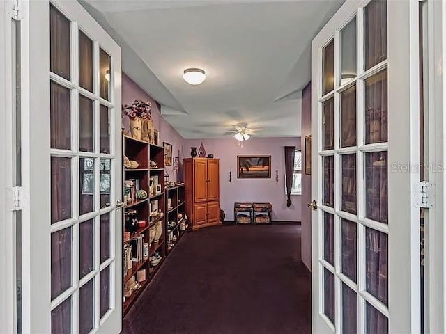 interior space featuring french doors and dark carpet