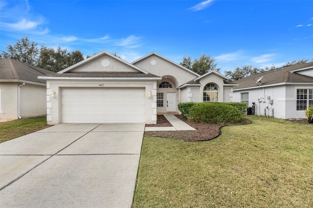 4605 Lisette Cir, Brooksville, FL 34604 - ranch-style home featuring stucco siding, a garage, driveway, a front lawn, and central AC
