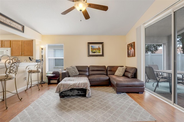 4605 Lisette Cir, Brooksville, FL 34604 - living room with light wood finished floors, ceiling fan, and lofted ceiling