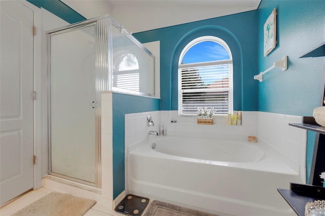 4605 Lisette Cir, Brooksville, FL 34604 - full bath featuring a garden tub, a shower stall, and tile patterned flooring