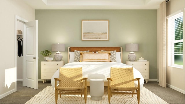 bedroom featuring a raised ceiling and carpet floors